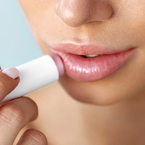 Apply lip balm regularly to avoid chapped lips.